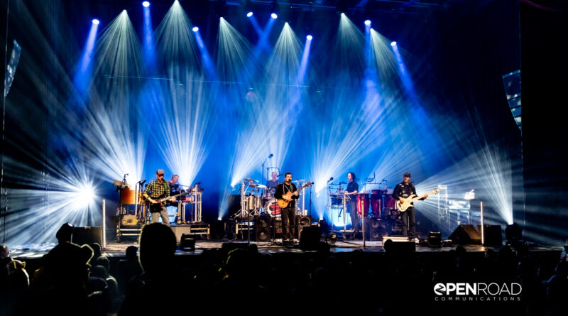 Wide photo of Umphrey's McGee bathed in bright white lights on stage at The Pageant.