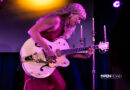 Iluka bending over her guitar during her The Wings Tour set in St. Louis