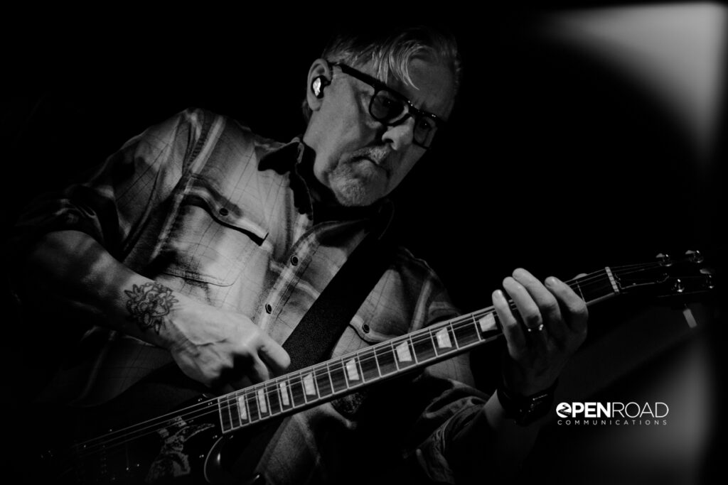 Toadies St. Louis. Profile of Vaden Todd Lewis playing guitar.