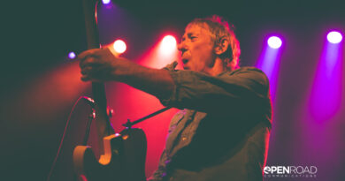 Buzzcocks singer Steve Diggle playing guitar and singing