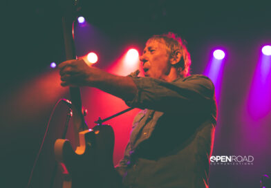 Buzzcocks singer Steve Diggle playing guitar and singing